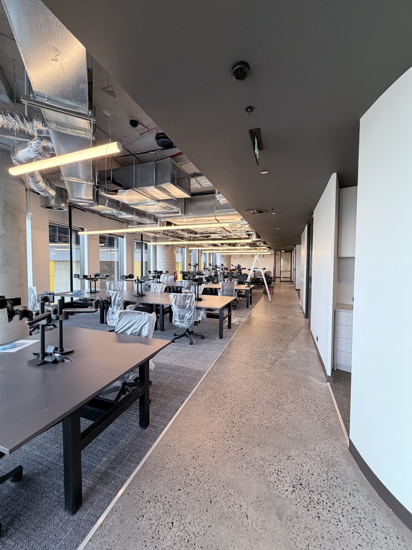 Dark painted ceiling over an office floor