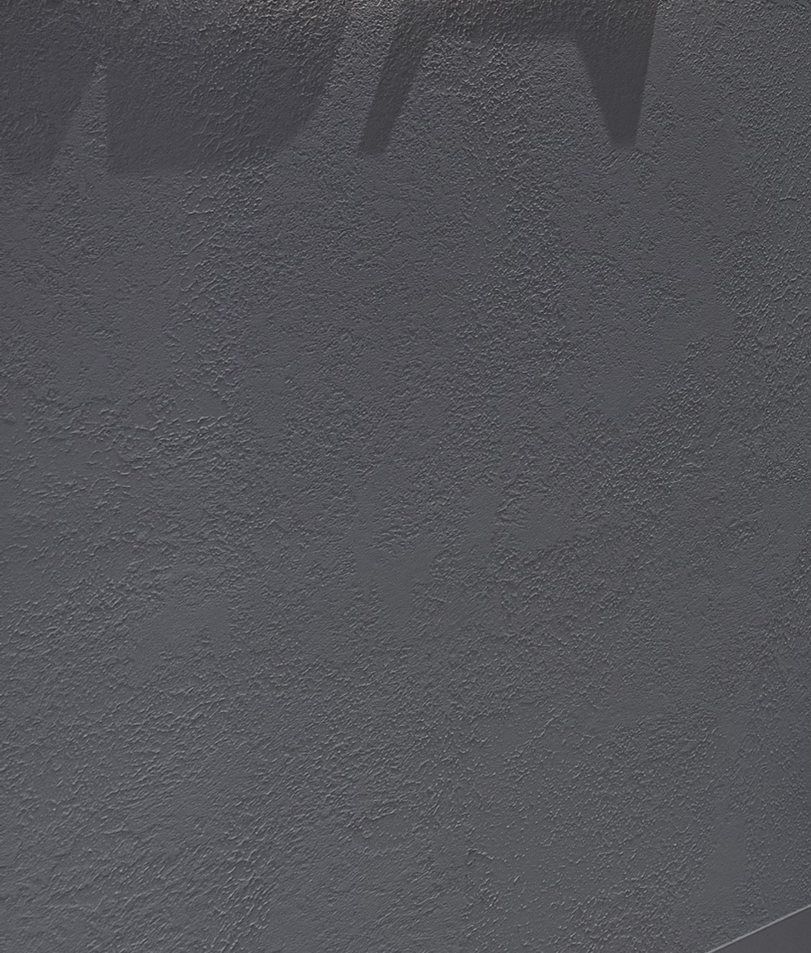 Grey textured render on a retail shopfront
